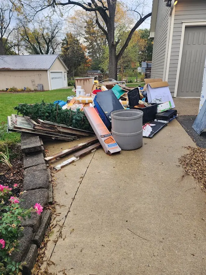 Dumpster being loaded with debris for 3 Yard Dumpster Rental in Scotch Plains